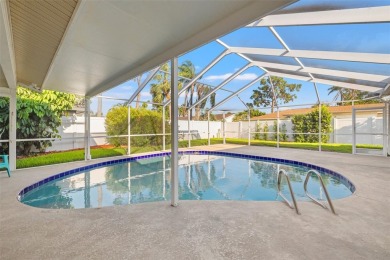 This spacious 4-bedroom, 3-bath POOL home is located in the on Mangrove Bay Golf Course in Florida - for sale on GolfHomes.com, golf home, golf lot