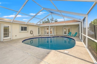 This spacious 4-bedroom, 3-bath POOL home is located in the on Mangrove Bay Golf Course in Florida - for sale on GolfHomes.com, golf home, golf lot