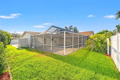 This spacious 4-bedroom, 3-bath POOL home is located in the on Mangrove Bay Golf Course in Florida - for sale on GolfHomes.com, golf home, golf lot