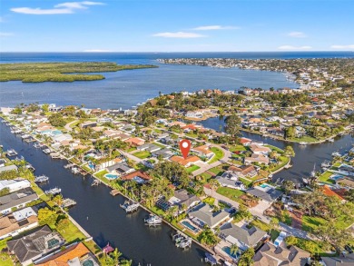 This spacious 4-bedroom, 3-bath POOL home is located in the on Mangrove Bay Golf Course in Florida - for sale on GolfHomes.com, golf home, golf lot