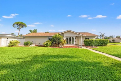 This spacious 4-bedroom, 3-bath POOL home is located in the on Mangrove Bay Golf Course in Florida - for sale on GolfHomes.com, golf home, golf lot