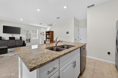 Live the Venetian Bay lifestyle in this stylish 2022-built on Venetian Bay Golf Course in Florida - for sale on GolfHomes.com, golf home, golf lot