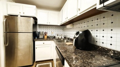Discover this beautifully updated 1-bedroom, 1.5-bath apartment on Inverrary Country Club in Florida - for sale on GolfHomes.com, golf home, golf lot