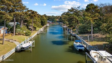 You just can't beat canal front living in Pine Knoll Shores! And on The Country Club of the Crystal Coast in North Carolina - for sale on GolfHomes.com, golf home, golf lot