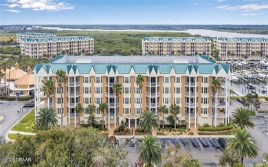 Bright open plan corner unit has TWO balconies overlooking woods on Harbour Village Golf and Yacht Club in Florida - for sale on GolfHomes.com, golf home, golf lot