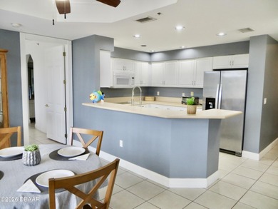 Bright open plan corner unit has TWO balconies overlooking woods on Harbour Village Golf and Yacht Club in Florida - for sale on GolfHomes.com, golf home, golf lot