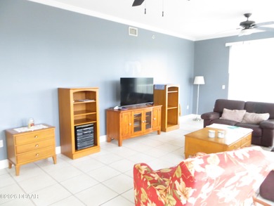 Bright open plan corner unit has TWO balconies overlooking woods on Harbour Village Golf and Yacht Club in Florida - for sale on GolfHomes.com, golf home, golf lot