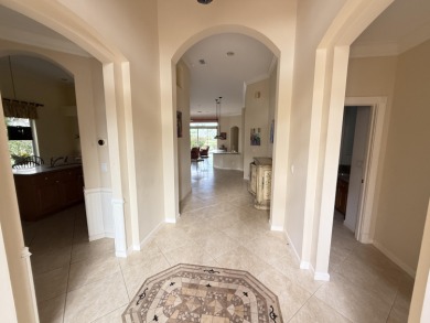 This 3-bedroom plus den, 3.5-bath home is located in the on Wycliffe Golf and Country Club in Florida - for sale on GolfHomes.com, golf home, golf lot