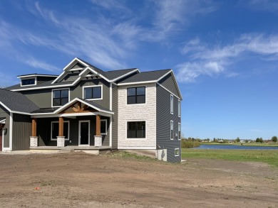 This home by Bosgraaf Homes is unlike any other, located in the on The Macatwa Legends Golf Course in Michigan - for sale on GolfHomes.com, golf home, golf lot