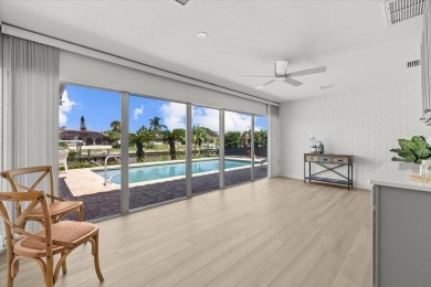 Tucked away in the prestigious waterfront enclave of Dana Shores on Rocky Point Golf Course in Florida - for sale on GolfHomes.com, golf home, golf lot