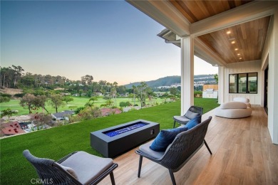 Rising above the prestigious El Niguel Country Club, this on El Niguel Country Club in California - for sale on GolfHomes.com, golf home, golf lot