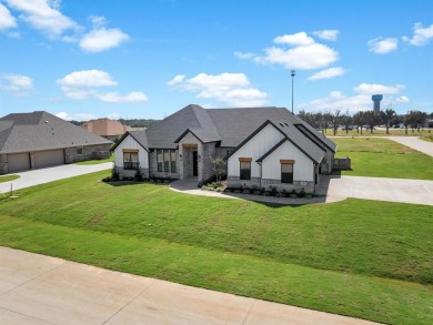 Experience refined living in the exclusive, guard-gated on Pecan Plantation Country Club in Texas - for sale on GolfHomes.com, golf home, golf lot