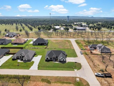 Experience refined living in the exclusive, guard-gated on Pecan Plantation Country Club in Texas - for sale on GolfHomes.com, golf home, golf lot