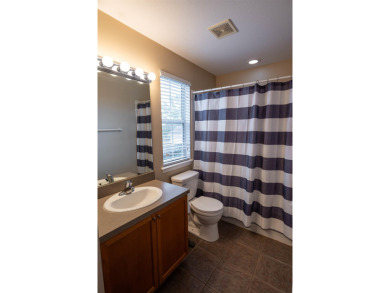 Bright and inviting 3-bedroom, 2.5-bath home with detached 2-car on Southwood Golf Club in Florida - for sale on GolfHomes.com, golf home, golf lot