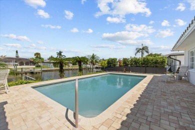 Tucked away in the prestigious waterfront enclave of Dana Shores on Rocky Point Golf Course in Florida - for sale on GolfHomes.com, golf home, golf lot