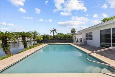 Tucked away in the prestigious waterfront enclave of Dana Shores on Rocky Point Golf Course in Florida - for sale on GolfHomes.com, golf home, golf lot