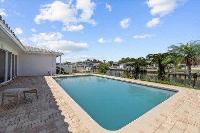 Tucked away in the prestigious waterfront enclave of Dana Shores on Rocky Point Golf Course in Florida - for sale on GolfHomes.com, golf home, golf lot