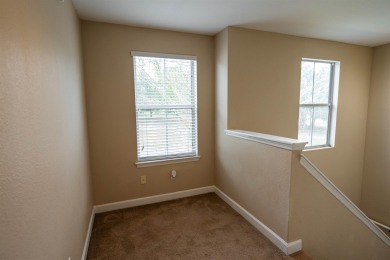Bright and inviting 3-bedroom, 2.5-bath home with detached 2-car on Southwood Golf Club in Florida - for sale on GolfHomes.com, golf home, golf lot