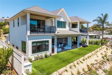 Rising above the prestigious El Niguel Country Club, this on El Niguel Country Club in California - for sale on GolfHomes.com, golf home, golf lot
