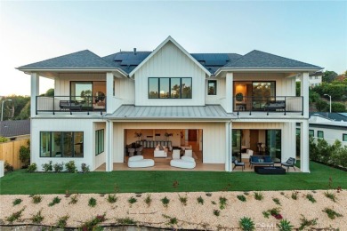 Rising above the prestigious El Niguel Country Club, this on El Niguel Country Club in California - for sale on GolfHomes.com, golf home, golf lot