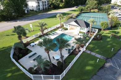 This immaculate 2nd-floor condo in the highly sought-after River on River Oaks Golf Plantation  in South Carolina - for sale on GolfHomes.com, golf home, golf lot