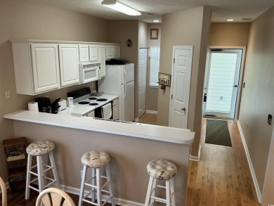 This immaculate 2nd-floor condo in the highly sought-after River on River Oaks Golf Plantation  in South Carolina - for sale on GolfHomes.com, golf home, golf lot