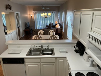 This immaculate 2nd-floor condo in the highly sought-after River on River Oaks Golf Plantation  in South Carolina - for sale on GolfHomes.com, golf home, golf lot