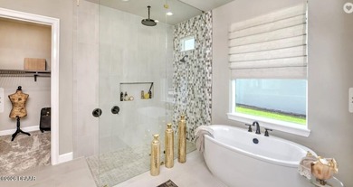 BRAND NEW CONSTRUCTION located on a picturesque lake in the on Plantation Bay Golf and Country Club in Florida - for sale on GolfHomes.com, golf home, golf lot