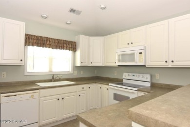 A Beautiful three bedroom, two bath home  with fenced back yard on Masonboro Country Club in North Carolina - for sale on GolfHomes.com, golf home, golf lot
