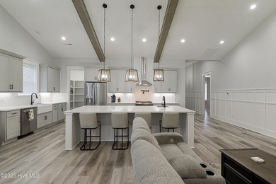 Step into this nearly new home where thoughtful design and on Brunswick Plantation and Golf Resorts in North Carolina - for sale on GolfHomes.com, golf home, golf lot