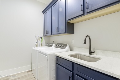 Step into this nearly new home where thoughtful design and on Brunswick Plantation and Golf Resorts in North Carolina - for sale on GolfHomes.com, golf home, golf lot