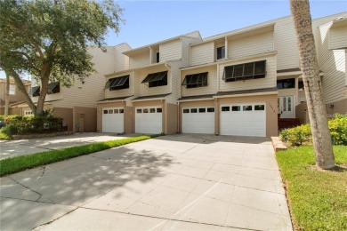 Welcome to your dream townhome that overlooks the 17th green of on Feather Sound Country Club in Florida - for sale on GolfHomes.com, golf home, golf lot