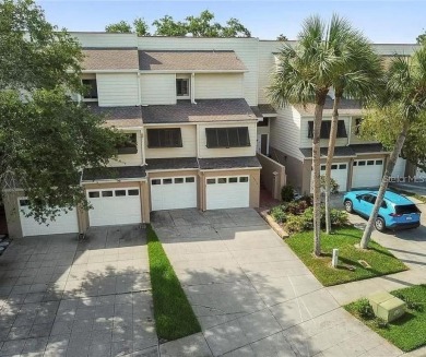 Welcome to your dream townhome that overlooks the 17th green of on Feather Sound Country Club in Florida - for sale on GolfHomes.com, golf home, golf lot