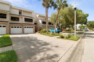 Welcome to your dream townhome that overlooks the 17th green of on Feather Sound Country Club in Florida - for sale on GolfHomes.com, golf home, golf lot