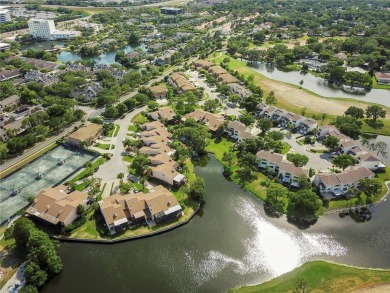 Welcome to your dream townhome that overlooks the 17th green of on Feather Sound Country Club in Florida - for sale on GolfHomes.com, golf home, golf lot