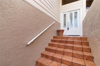 Welcome to your dream townhome that overlooks the 17th green of on Feather Sound Country Club in Florida - for sale on GolfHomes.com, golf home, golf lot