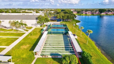 Welcome home to this charming first-floor corner 2-bedroom on Kings Point Golf - Executive in Florida - for sale on GolfHomes.com, golf home, golf lot