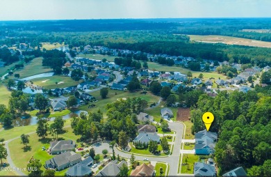 Step into this nearly new home where thoughtful design and on Brunswick Plantation and Golf Resorts in North Carolina - for sale on GolfHomes.com, golf home, golf lot