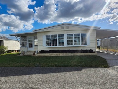 Exquisitely FURNISHED 2 Bedroom, 2 Bath home has all the charm! on Grasslands Golf and Country Club in Florida - for sale on GolfHomes.com, golf home, golf lot