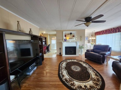 Exquisitely FURNISHED 2 Bedroom, 2 Bath home has all the charm! on Grasslands Golf and Country Club in Florida - for sale on GolfHomes.com, golf home, golf lot