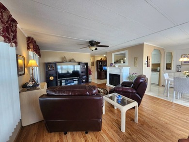 Exquisitely FURNISHED 2 Bedroom, 2 Bath home has all the charm! on Grasslands Golf and Country Club in Florida - for sale on GolfHomes.com, golf home, golf lot