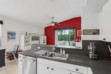 Spacious, meticulously maintained home in a gated community with on Woodmont Country Club in Florida - for sale on GolfHomes.com, golf home, golf lot