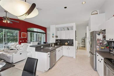 Spacious, meticulously maintained home in a gated community with on Woodmont Country Club in Florida - for sale on GolfHomes.com, golf home, golf lot