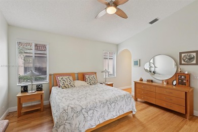 Spacious, meticulously maintained home in a gated community with on Woodmont Country Club in Florida - for sale on GolfHomes.com, golf home, golf lot