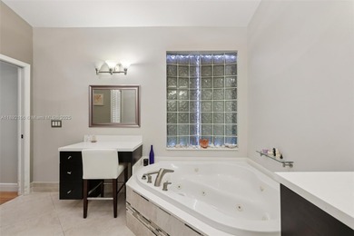 Spacious, meticulously maintained home in a gated community with on Woodmont Country Club in Florida - for sale on GolfHomes.com, golf home, golf lot