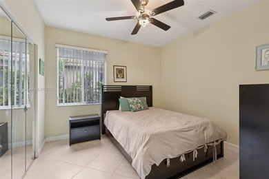 Spacious, meticulously maintained home in a gated community with on Woodmont Country Club in Florida - for sale on GolfHomes.com, golf home, golf lot