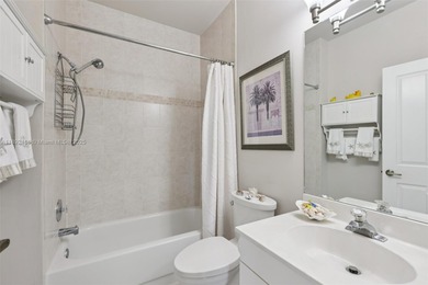 Spacious, meticulously maintained home in a gated community with on Woodmont Country Club in Florida - for sale on GolfHomes.com, golf home, golf lot