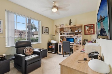 Spacious, meticulously maintained home in a gated community with on Woodmont Country Club in Florida - for sale on GolfHomes.com, golf home, golf lot