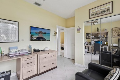 Spacious, meticulously maintained home in a gated community with on Woodmont Country Club in Florida - for sale on GolfHomes.com, golf home, golf lot