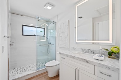 Enveloped within the beauty of its natural setting and defined on Seagate Country Club in Florida - for sale on GolfHomes.com, golf home, golf lot